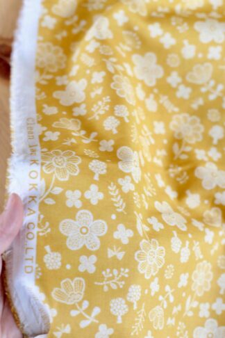 Algodón floral mostaza y crema
